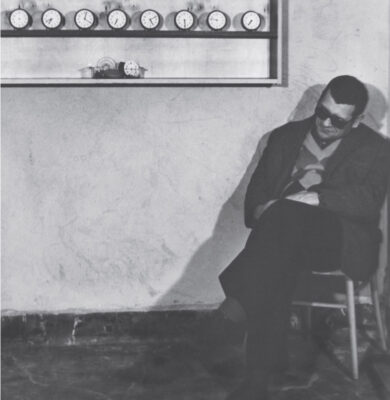 Stanisław Dróżdż next to 'Untitled (clocks)',1978, Photo Michał Bieganowski, Wojciech Sztukowski, Courtesy Anna Dróżdż